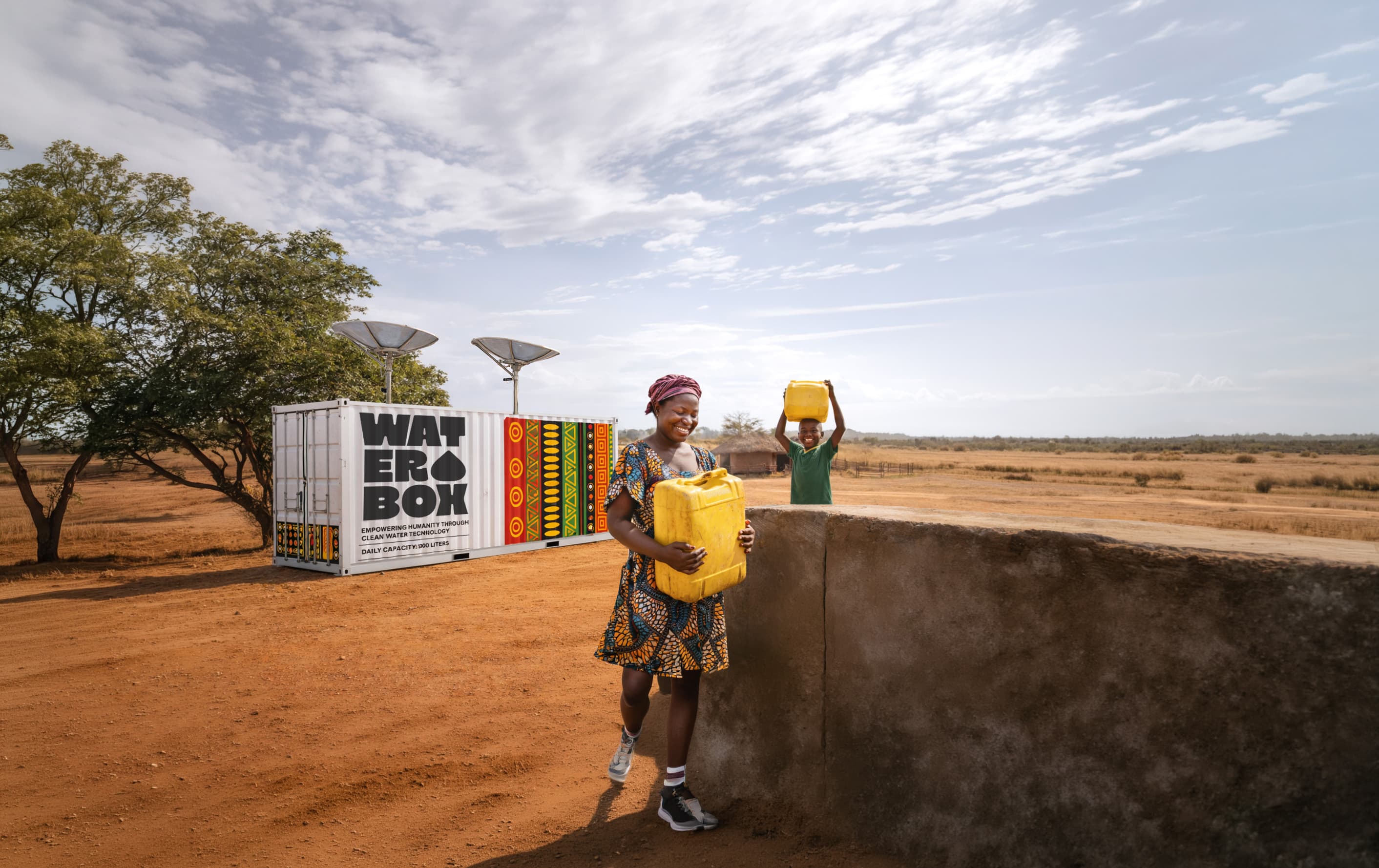 WATERBOX deployed in an African village — a woman and child walk past with jerry cans