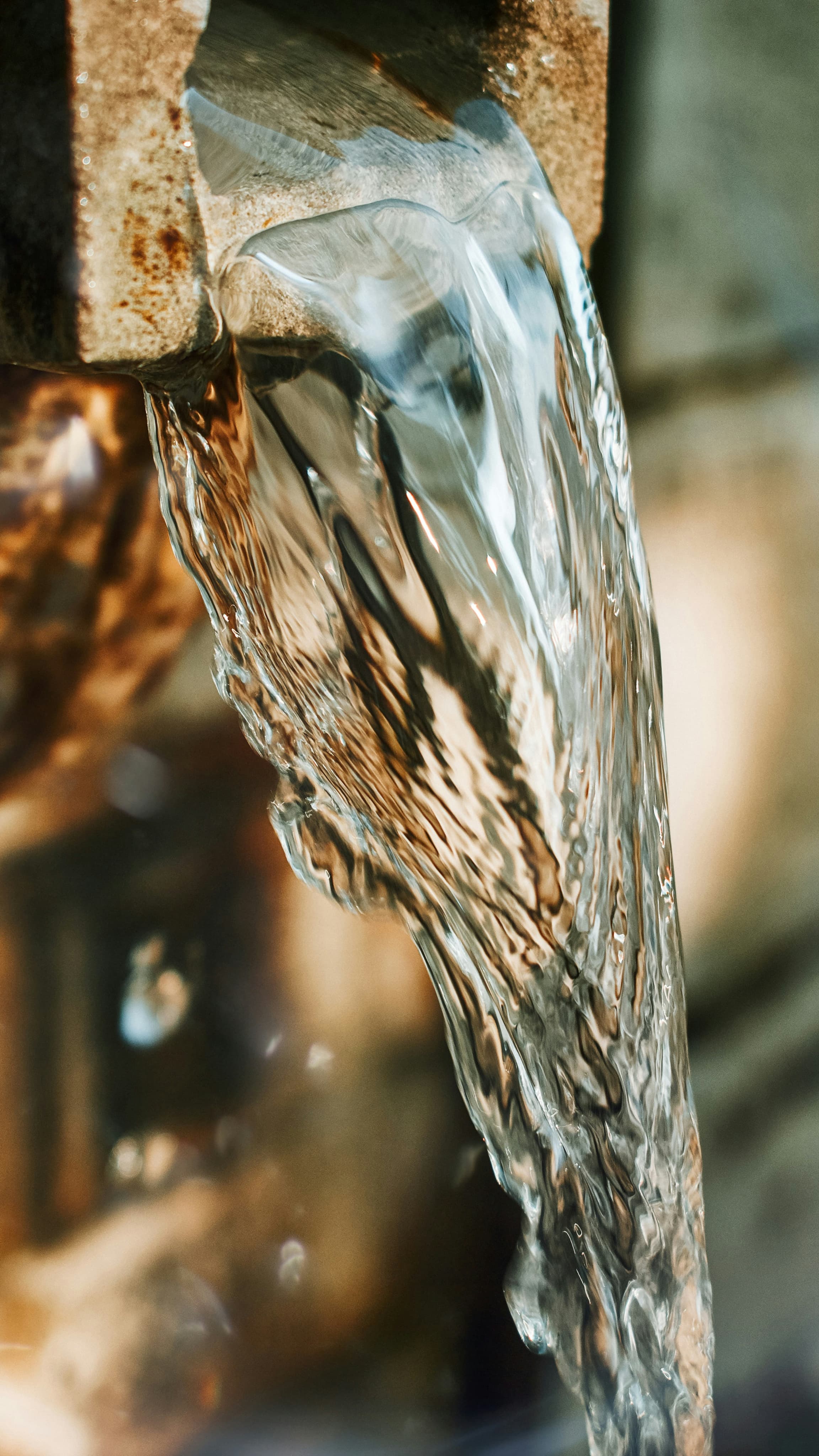Close-up of clean drinking water from a spout